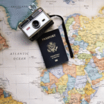 Camera and passport on a map.